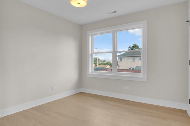 spare room with light hardwood / wood-style floors