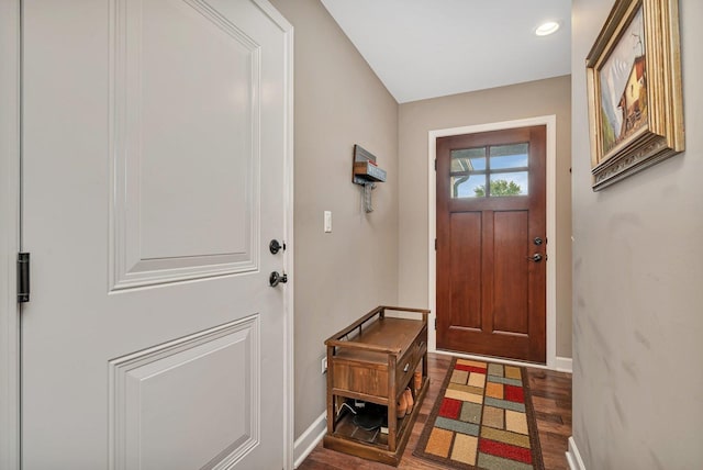 interior space with dark wood finished floors and baseboards