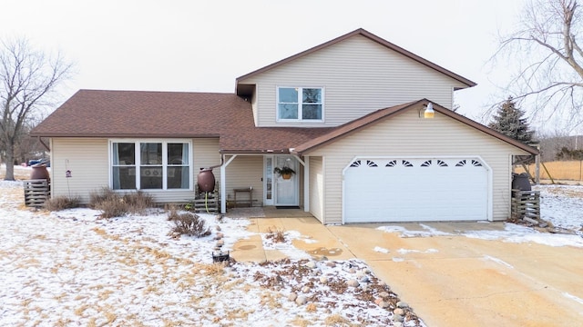 tri-level home featuring a shingled roof