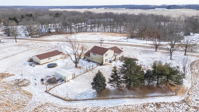 snowy aerial view featuring a rural view