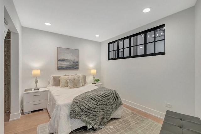 bedroom featuring recessed lighting, light wood-style flooring, and baseboards