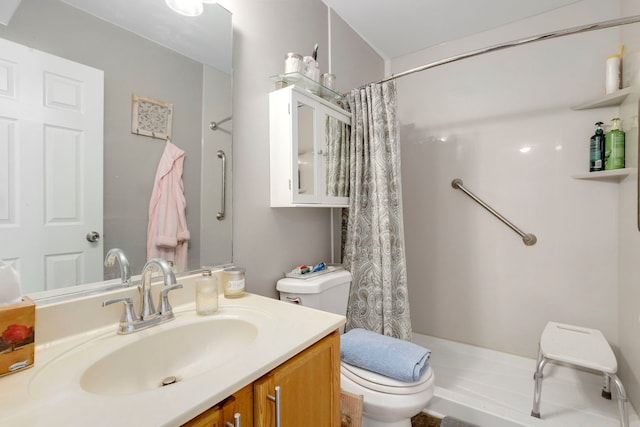 bathroom featuring curtained shower, vanity, and toilet