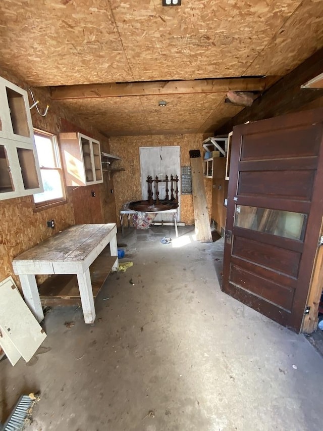 interior space featuring unfinished concrete flooring