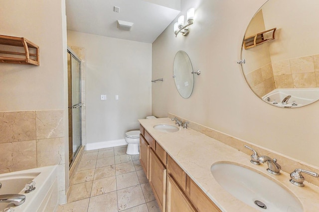 full bathroom with a sink, toilet, and a bath