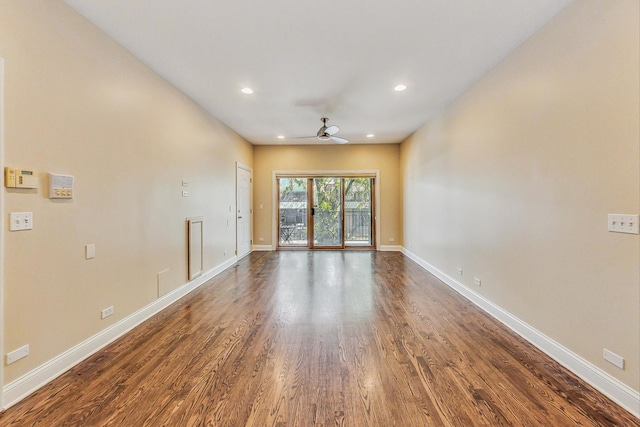 empty room featuring ceiling fan, baseboards, dark wood-style flooring, and recessed lighting