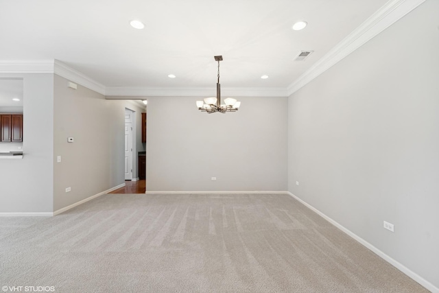 unfurnished room with light carpet, visible vents, ornamental molding, and baseboards