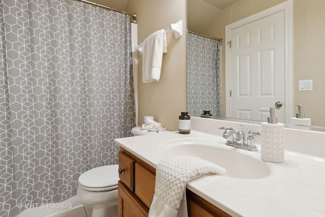 bathroom featuring toilet and vanity