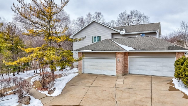 traditional home with a garage, concrete driveway, brick siding, and a shingled roof