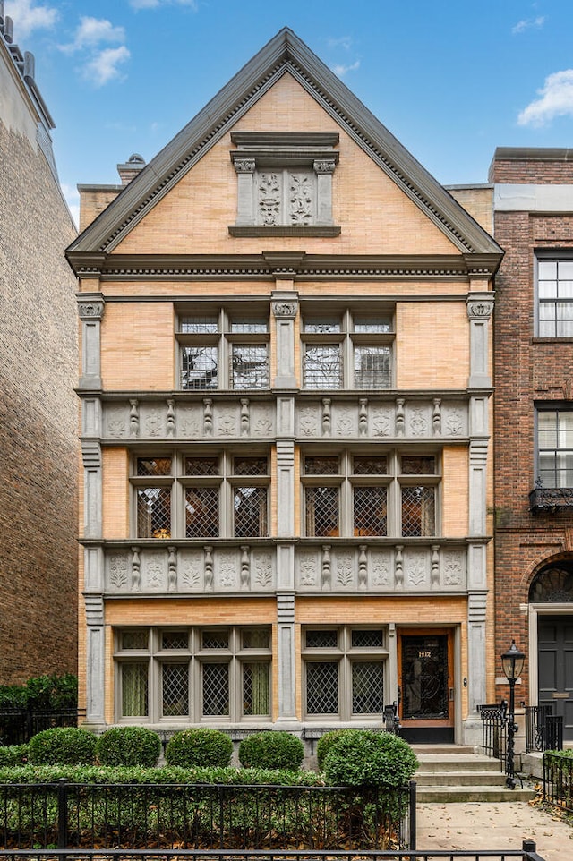 view of building exterior with a fenced front yard