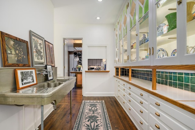 interior space with dark wood-style flooring and recessed lighting