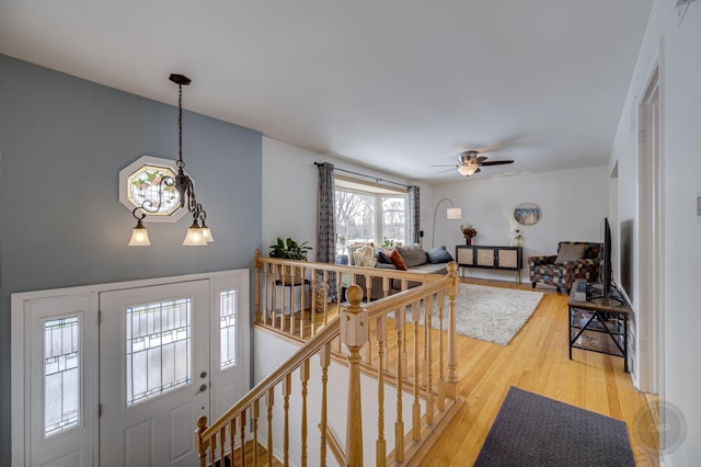 interior space with wood finished floors and a ceiling fan