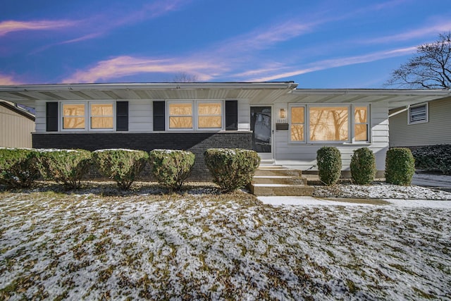 view of front of house featuring brick siding