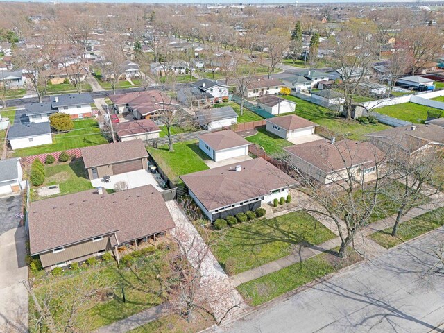 birds eye view of property with a residential view