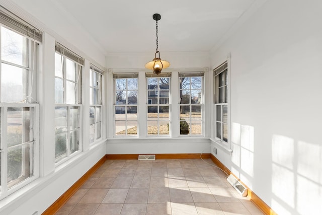 unfurnished sunroom featuring visible vents