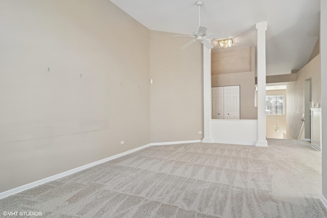 empty room featuring a ceiling fan, lofted ceiling, light carpet, and baseboards