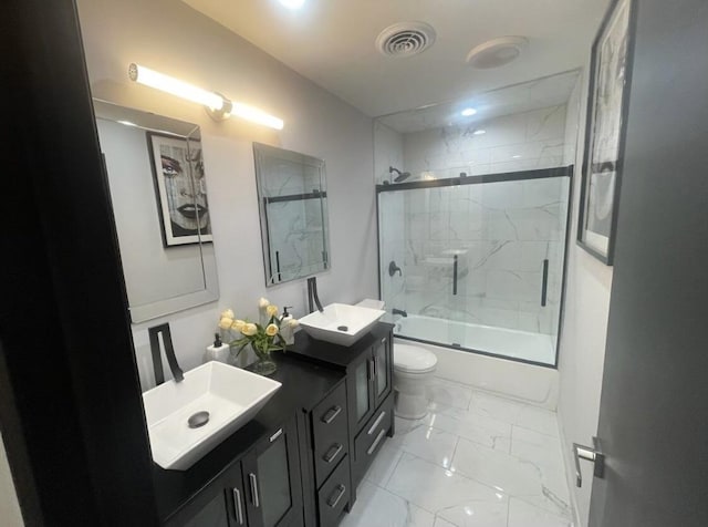 bathroom with toilet, shower / bath combination with glass door, a sink, visible vents, and marble finish floor