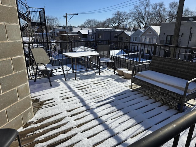2147 W Belmont Ave, Chicago, IL 60618 - snow covered deck featuring an outdoor living space and a residential view