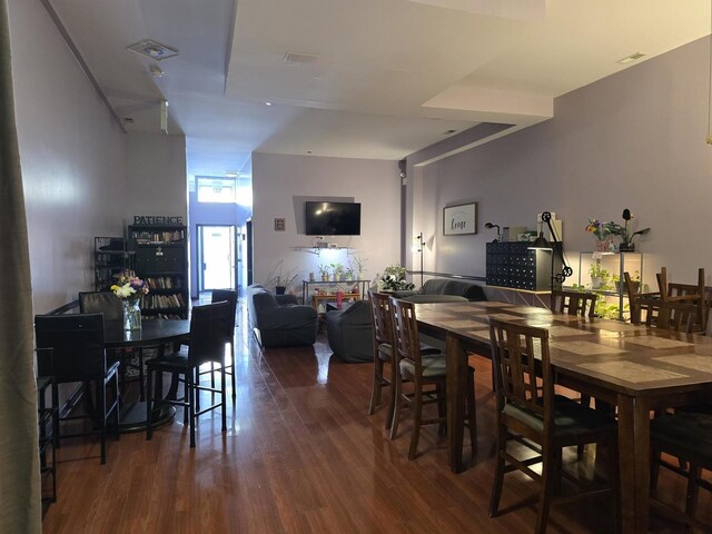 2147 W Belmont Ave, Chicago, IL 60618 - dining room featuring visible vents and dark wood-style flooring