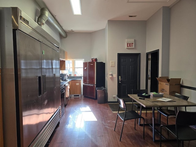 2147 W Belmont Ave, Chicago, IL 60618 - kitchen featuring refrigerator, dark wood-type flooring, a towering ceiling, and stainless steel built in fridge