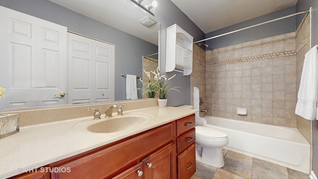 full bath featuring toilet,  shower combination, and vanity