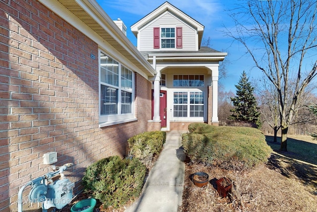 entrance to property with brick siding