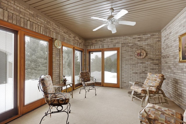 sunroom featuring ceiling fan