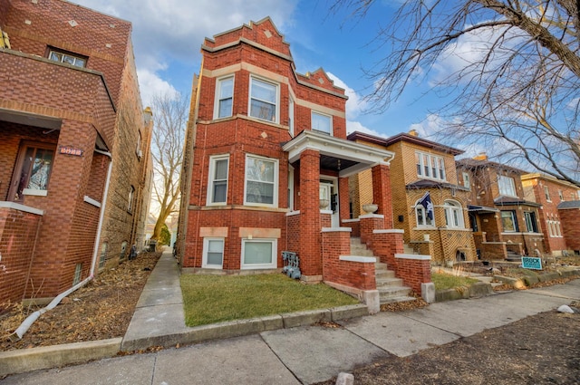 view of front of home with brick siding