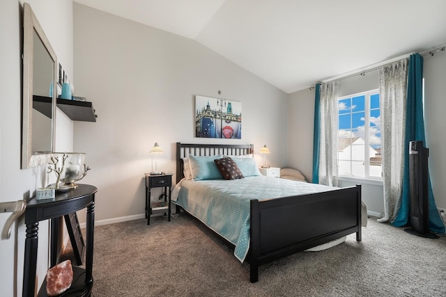 carpeted bedroom with vaulted ceiling and baseboards