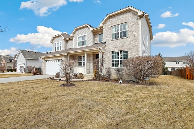 view of front facade featuring a garage, brick siding, concrete driveway, fence, and a front yard