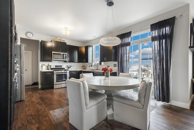 dining room with dark wood-style floors and baseboards