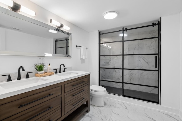 full bath featuring marble finish floor, a sink, a shower stall, and double vanity