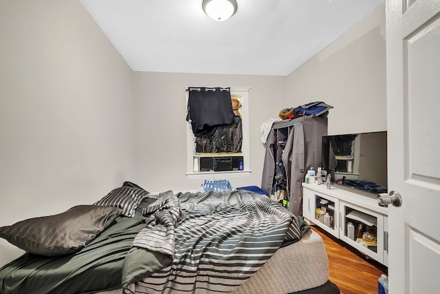 bedroom with wood finished floors