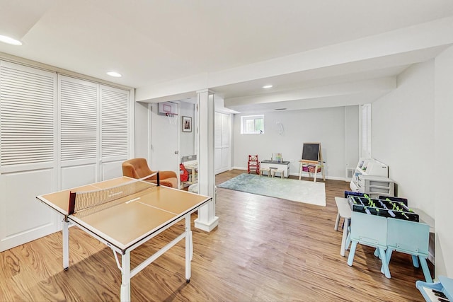 playroom featuring baseboards, light wood-type flooring, and recessed lighting