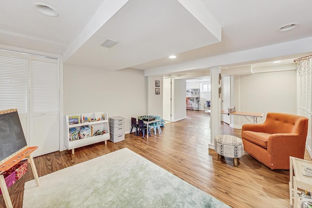 sitting room featuring recessed lighting, visible vents, and wood finished floors