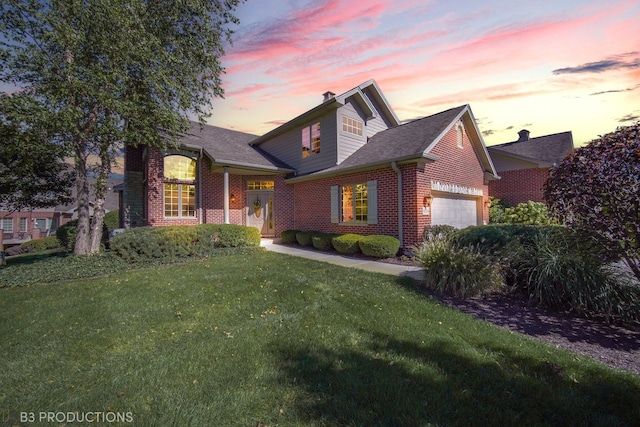 view of front of house featuring a garage, a yard, brick siding, and a shingled roof