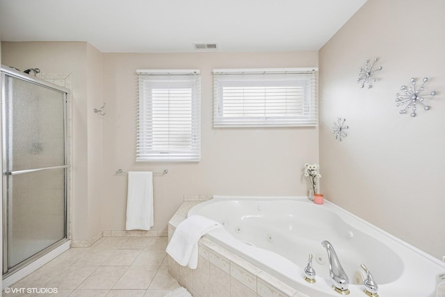 full bath featuring a tub with jets, a stall shower, tile patterned flooring, and visible vents