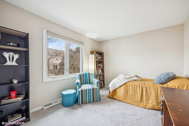 bedroom featuring baseboards, visible vents, and carpet flooring