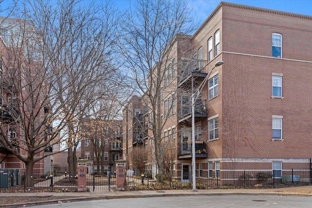 view of building exterior featuring fence