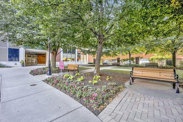 view of community featuring fence