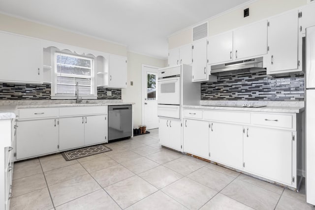 kitchen with open shelves, light countertops, a sink, dishwasher, and under cabinet range hood