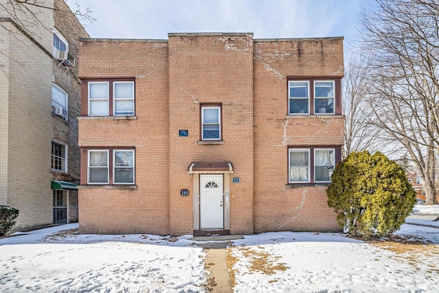 view of property featuring brick siding