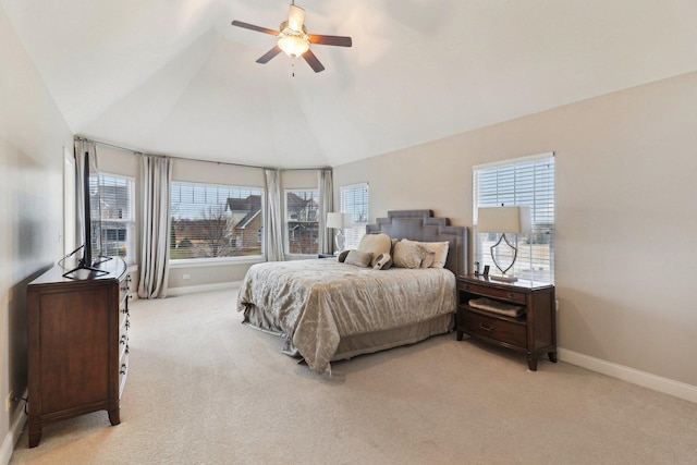 bedroom with lofted ceiling, ceiling fan, baseboards, and light colored carpet