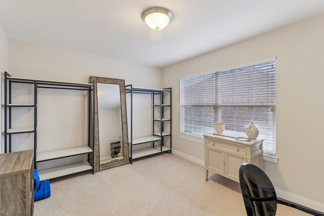 office featuring light carpet and baseboards