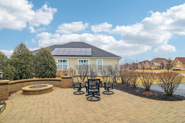 view of patio featuring outdoor dining area and a fire pit