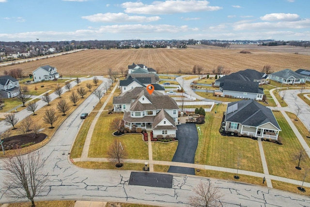 birds eye view of property with a residential view and a rural view