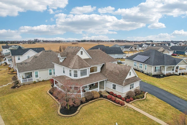 birds eye view of property with a residential view