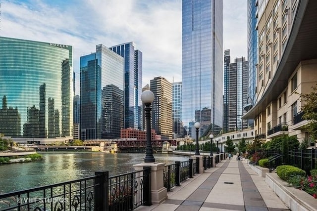 property's view of city featuring a water view