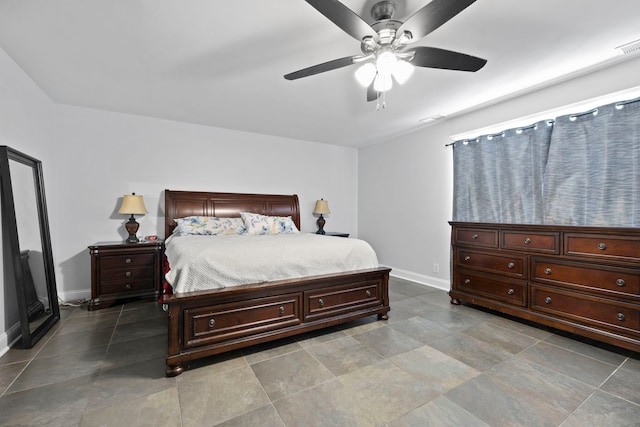 bedroom featuring visible vents, a ceiling fan, and baseboards