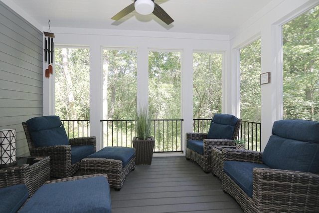 sunroom / solarium with a ceiling fan