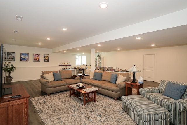 living area featuring recessed lighting, bar, visible vents, and dark wood finished floors